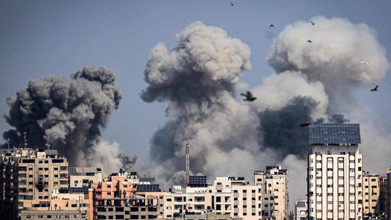 Smoke plumes billow during Israeli air strikes in Gaza City on October 12. Picture: Mahmud HAMS / AFP