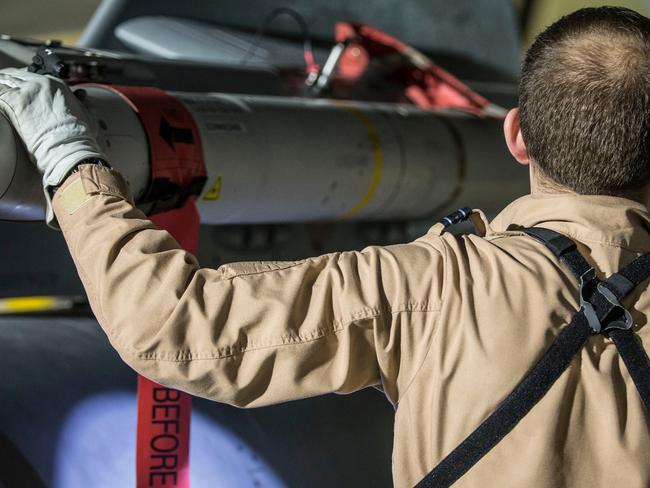 A Tornado pilot checks the weapons on his Tornado at Britain Royal Air Force base in Akrotiri, Cyprus, after its mission to conduct strikes in Syria to punish President Bashar Assad for an apparent chemical attack against civilians. Picture: Cpl L Matthews/MoD via AP