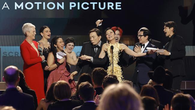 Jamie Lee Curtis, Jenny Slate, Stephanie Hsu, Tallie Medel, James Hong, Michelle Yeoh, Andy Le, Ke Huy Quan, and Harry Shum Jr. accept the Outstanding Performance by a Cast in a Motion Picture award for "Everything Everywhere All at Once" onstage during the 29th Annual Screen Actors Guild Awards at Fairmont Century Plaza.