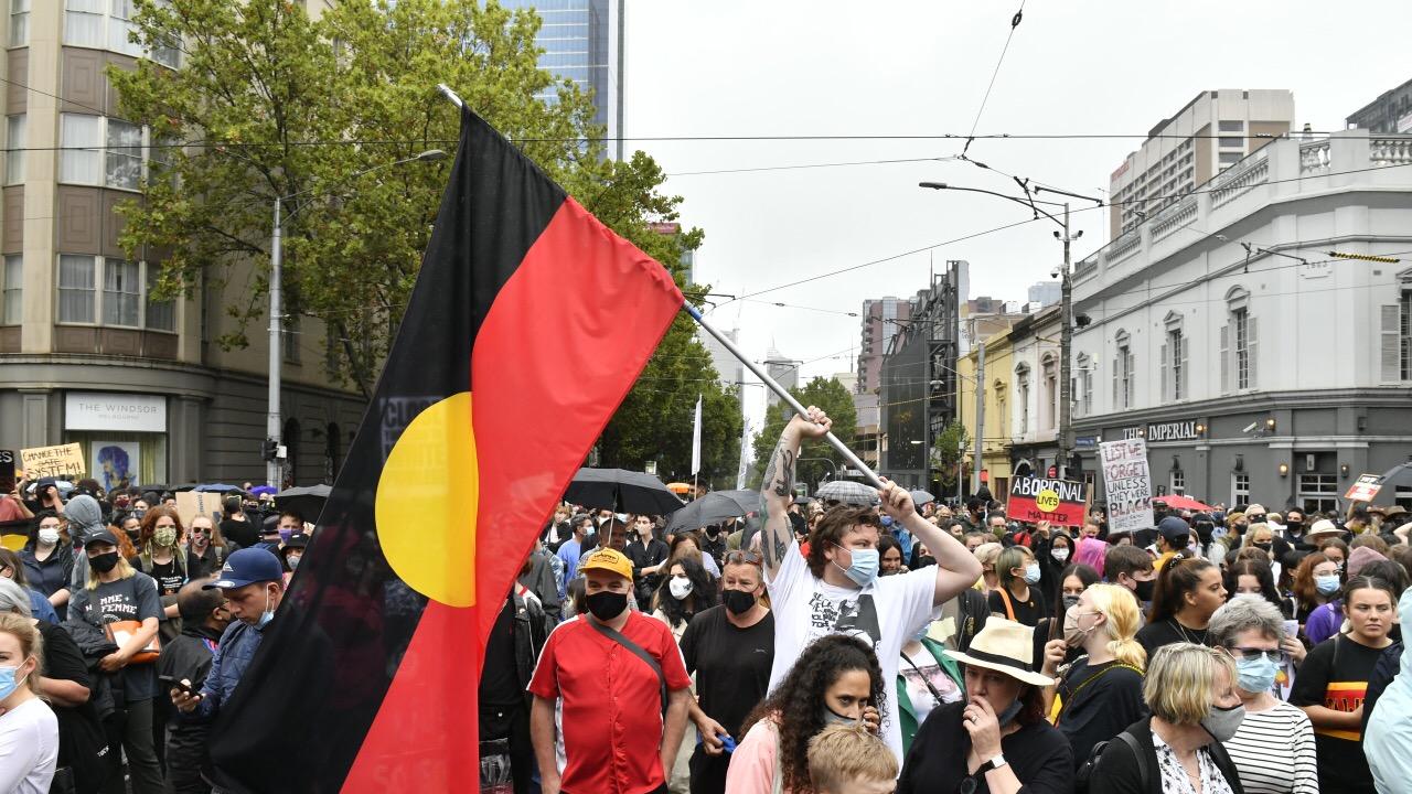 Protesters gather at State Parliament to rally against Australia Day Picture: Jake Nowakowski