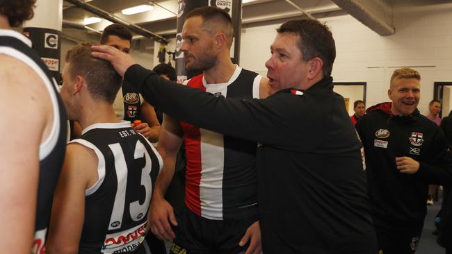 Brett Ratten celebrates the win with his players. Picture: AAP