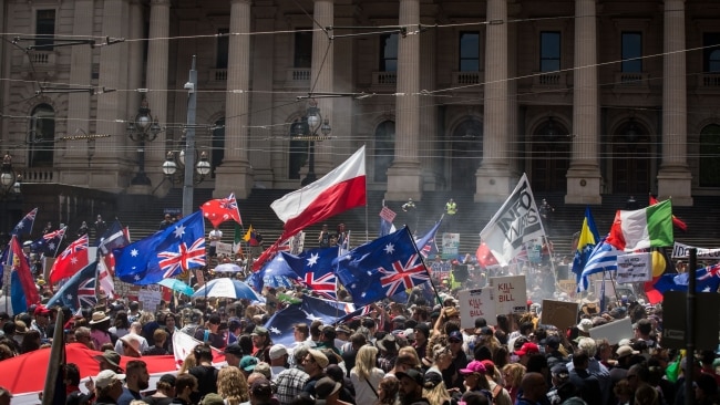 Protesters gather on the steps of Parliament House in Melbourne on Saturday. Picture: Darrian Traynor/Getty Images