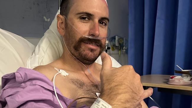 A young Northside dad is waiting on the results of a surgery that removed a mass of tumour twisted around arteries in his brain, just one week after a horrific seizure rushed him to hospital.