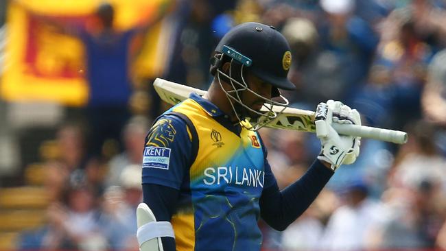 Sri Lanka's captain Dimuth Karunaratne celebrates after scoring a half-century and was Sri Lanka’s last man out. Picture: Geoff Caddick/AFP