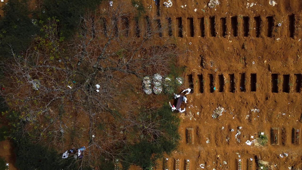 A coffin being buried at the Vila Formosa cemetery in Sao Paulo, Brazil, amid a devastating surge in new cases linked to the P1 variant. Picture: AFP