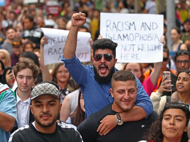 MELBOURNE, AUSTRALIA - MARCH 19: Protesters hold placards aloft as they march during the Stand Against Racism and Islamophobia: Fraser Anning Resign! rally on March 19, 2019 in Melbourne, Australia. The protesters are calling for the resignation of Senator Fraser Anning, following the statement he issued within hours of the Christchurch terror attacks on Friday 15 March, linking the shootings at two mosques to immigration. Those attacks killed 50 people and have left dozens more injured. The accused attacker, 28-year-old Australian, Brenton Tarrant, has been charged with murder and remanded in custody until April 5. The attack is the worst mass shooting in New Zealand's history. (Photo by Scott Barbour/Getty Images)