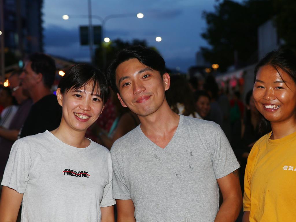 Linda Lai, Hank Chan and Lea Li at the Cairns and District Chinese Association Inc Chinese New Year street festival on Grafton Street. PICTURE: BRENDAN RADKE