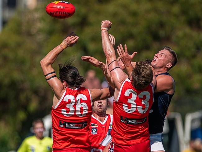 Sorrento's James Brigden (left) and Nick Marston (33) fly for a mark against Rosebud. Pictrure: David Caspar