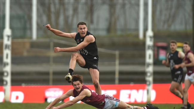 Hawkins clears for the Magpies against PAOC in the grand final. Picture: Tricia Watkinson