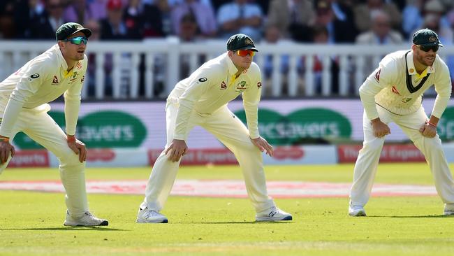 Australia's Cameron Bancroft, left, Steve Smith and David Warner, right, stand in the slips on the second day of the second Ashes cricket Test match between England and Australia at Lord's. Picture: Glyn Kirk/AFP