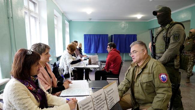 Konstantin Ivashchenko, former CEO of the Azovmash plant and appointed pro-Russian mayor of Mariupol, visits a polling station as people vote in a referendum in Mariupol.