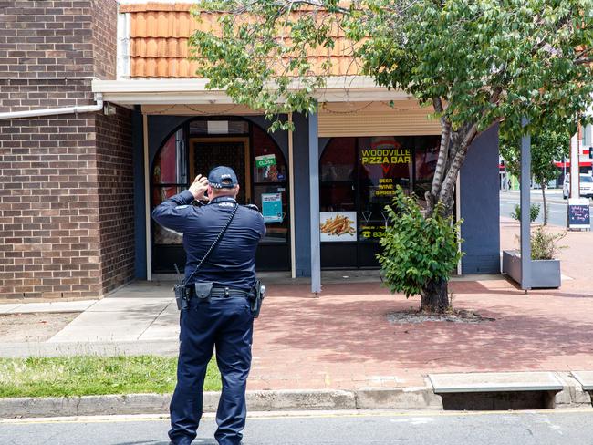 A police investigator outside the Woodville Pizza Bar on Friday. Picture: Matt Turner