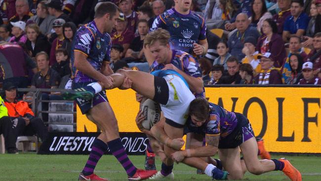 Cameron Smith lifts the leg of Kevin Proctor which injures his groin.
