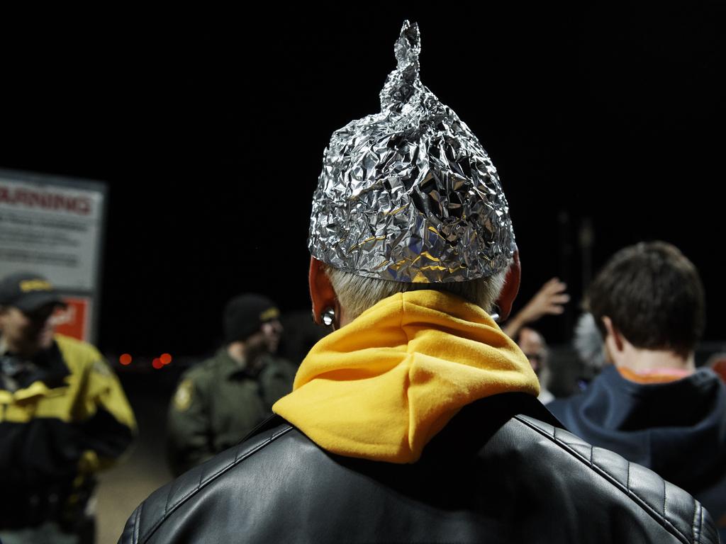 Attendee Daniel Rodriguez wears at tinfoil hat as he waited to ‘storm’ Area 51. Picture: Bridget BENNETT / AFP