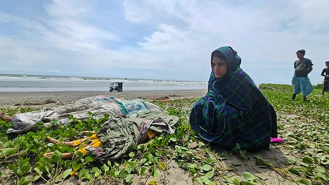 Relatives mourn near bodies of Rohingya refugees who drowned in the Naf river when their boat sunk while they were fleeing war-torn Myanmar. Picture: AFP