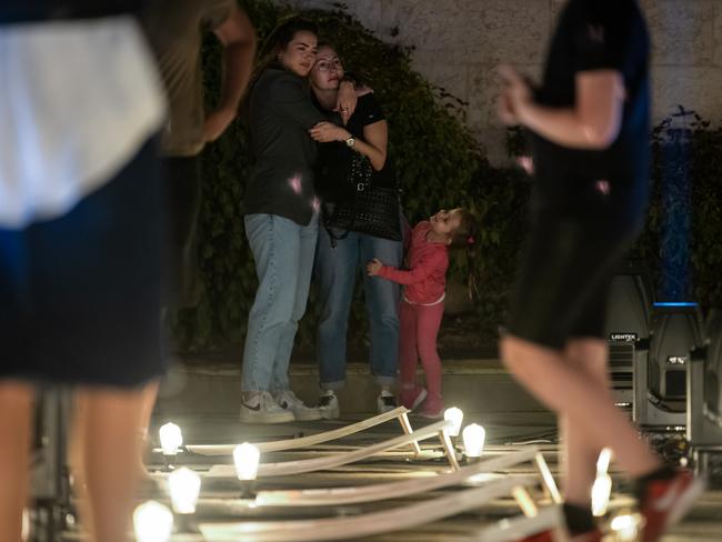 Families and friends of hostages cry and embrace while visiting the Lights of Hope installation featuring photos of the hostages in Jerusalem, Israel. Picture: Getty Images