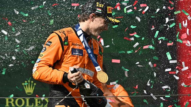 McLaren-Mercedes' Oscar Piastri celebrates on the podium after the Formula One Hungarian Grand Prix. Picture: AFP