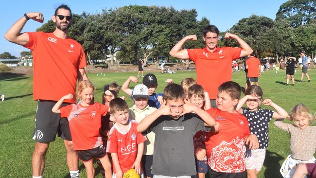 Sydney Swans stars Brodie Grundy and Indhi Kirk with keen junior AFL players at Heffron Park. Picture: Sean Teuma