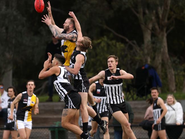 EFL: Ben Slattery of Chirnside Park with a massive launch. Photo: Hamish Blair