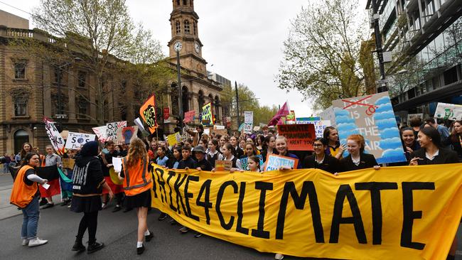 The march heads past the Town Hall. Picture: AAP / David Mariuz