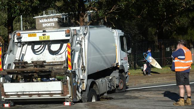 A garbage truck falls into a busted water mains sink hole in Narrabeen, Wednesday, July 29, 2020. Picture: NCA NewsWire / Jeremy Piper