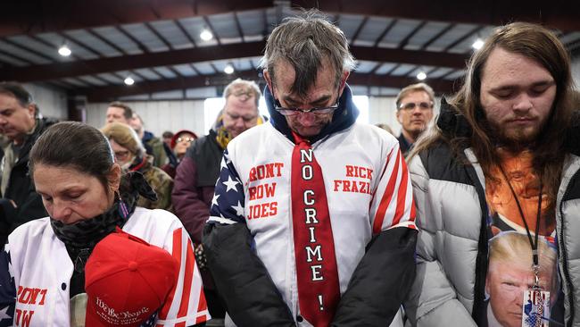 Prayers at a rally hosted by Donald Trump last month in Waterford, Michigan. People waited in lines for hours outside the event as temperatures held in the mid-20s and a strong wind cut through the crowd. Picture: Getty Images via AFP