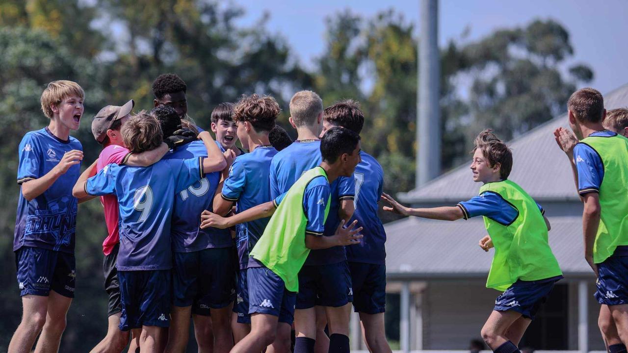 The SWQ Thunder U14 boys squad celebrate their grand final win.