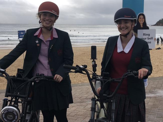 Stella Maris College Manly students, Milly Ristuccia, 16, and Adelaide Yiend, 13, at the launch of the "E Bike – Know The Code" campaign. Picture: Jim O’Rourke