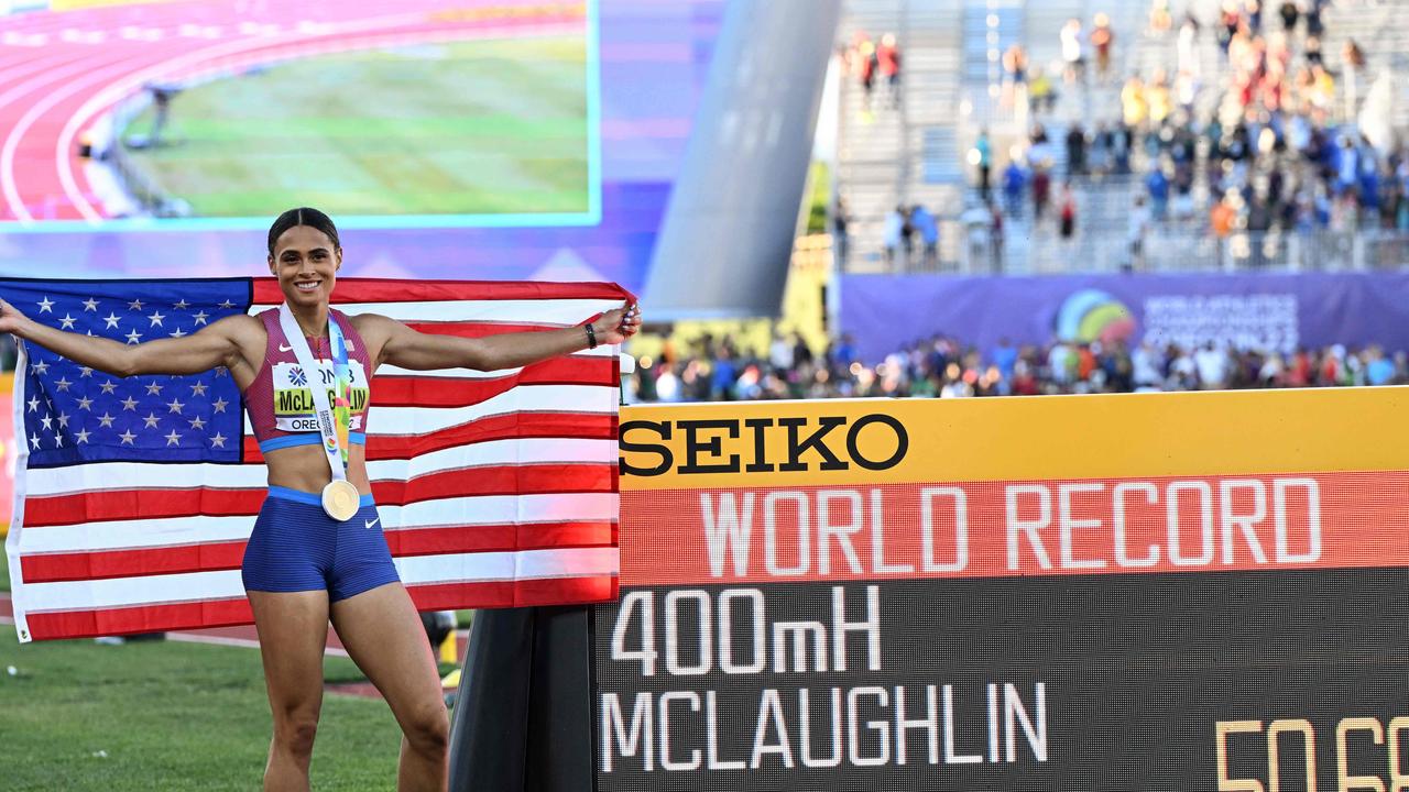 Sydney McLaughlin celebrates after smashing her own world record. (Photo by Jewel SAMAD / AFP)