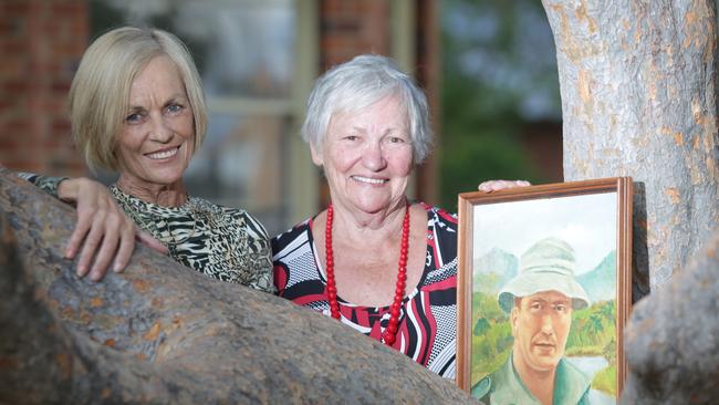 Ellie Roach and mum Edna Wheatley with a prized painting of Kevin Wheatley VC.