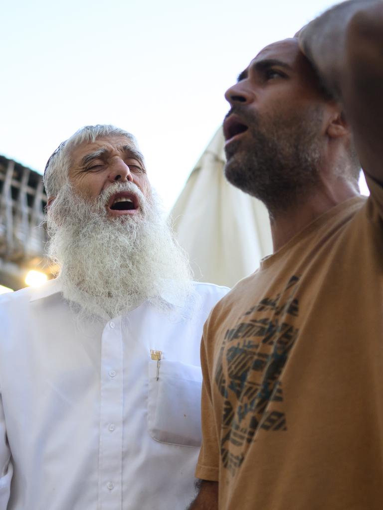 Avichai Broduch (right), whose wife and three children were abducted by Hamas militants, prays for their safe return on October 19, 2023, in Jerusalem, Israel. Picture: Leon Neal/Getty Images