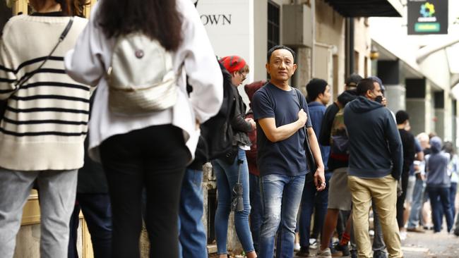 Sydney residents in Darlinghurst line up at the local Centrelink office to claim benefits after losing their jobs due to the COVID-19 pandemic sweeping the globe. Picture: Sam Ruttyn