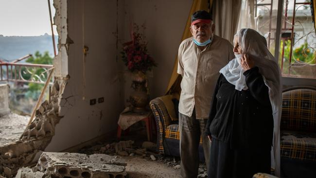 Salim and Nabiha Mohammed Ghrobar in the destroyed living room of their home. Picture: Oliver Marsden/The Times