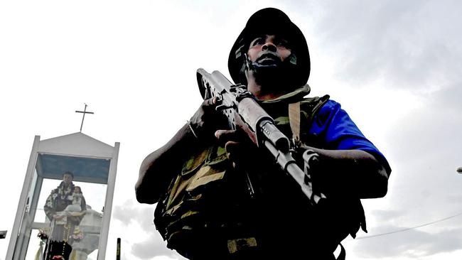 A Sri Lankan soldier stands guard outside a church in Colombo. Photo by Jewel Samad / AFP