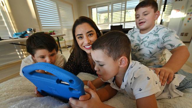 ‘(Our kids) absolutely live and breathe technology,’ says Kathrine Peereboom, with her sons, Joshua, Tyler and Oliver. Picture: Lyndon Mechielsen