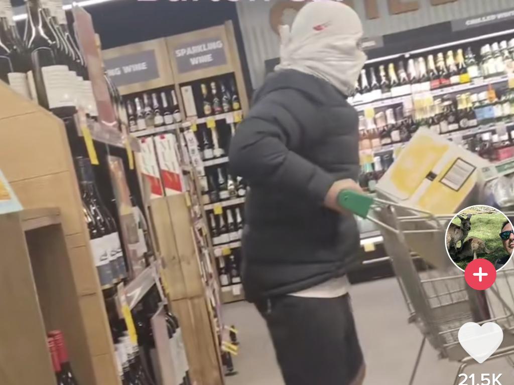 The men made off with trolley loads full of vodka cruisers from BWS. Picture: TikTok