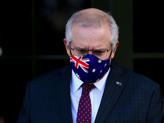 Australian Prime Minister Scott Morrison arrives to speak to the media during a press conference in Canberra, Thursday, July 22, 2021. (AAP Image/Lukas Coch) NO ARCHIVING