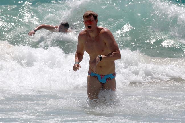 Matt Galian runs out of the water during the Southport Sharks VFL team during a preseason training camp at Tallebudgera Beach. Picture: Mike Batterham