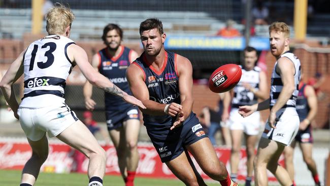 Norwood’s Mitch Grigg gets a handpass away against South Adelaide at Coopers Stadium this season. Picture: Sarah Reed