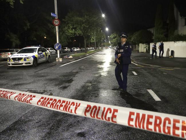 A police officer patrols the area where the shooting took place. Picture: AP