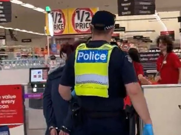 Police officers arrest a women in Bay Street, Port Melbourne  for stealing on Tuesday. Source: Supplied,