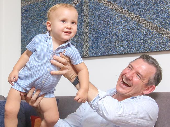 NT Chief Minister Michael Gunner and son Hudson a year after his Re election.Picture: Glenn Campbell