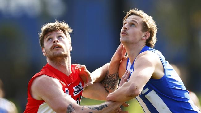 MELBOURNE, AUSTRALIA - AUGUST 07: Peter Ladhams of the Swans and Jacob Edwards of the Kangaroos zcduring the round 20 VFL match between North Melbourne Kangaroos and Sydney Swans at Arden Street Ground on August 07, 2022 in Melbourne, Australia. (Photo by Daniel Pockett/AFL Photos/via Getty Images)