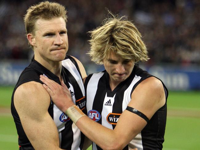 A shattered Buckley, seen here with former teammate Dale Thomas, after the 2007 preliminary final.