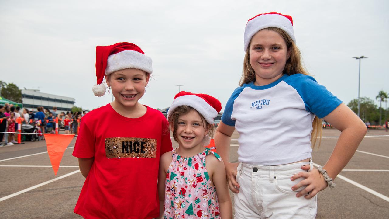 Savannah Mole, Shannon Mcarthy and Lily Rose Mcarthy at Casuarina square waiting on the arrival of Santa Claus in Darwin. Picture: Pema Tamang Pakhrin