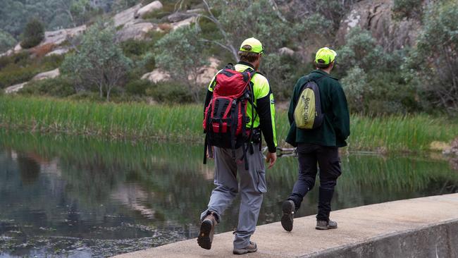 Bush search and rescue members look around the reservoir. Picture: Sarah Matray