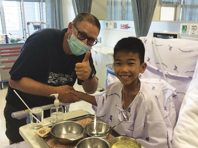 Richard Harris meeting Titan from The Wild Boars soccer team in hospital. Image taken from the book 'Against the Odds' by Richard Harris and Craig Challen.