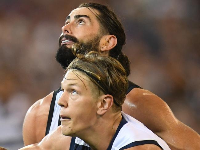 Brodie Grundy of the Magpies (left) and Rhys Stanley of the Cats contest during the Round 1 AFL match between the Collingwood Magpies and the Geelong Cats at the MCG in Melbourne, Friday, March 22, 2019. (AAP Image/Julian Smith) NO ARCHIVING, EDITORIAL USE ONLY