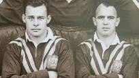 Alex Watson (left) sitting with Immortal Clive Churchill in the Australian team photo from 1955.