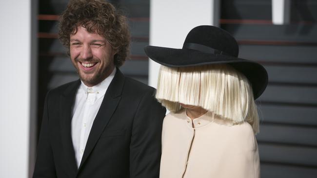 All smiles ... Erik Anders Lang and Sia at Vanity Fair’s Oscars party in Beverly Hills.
